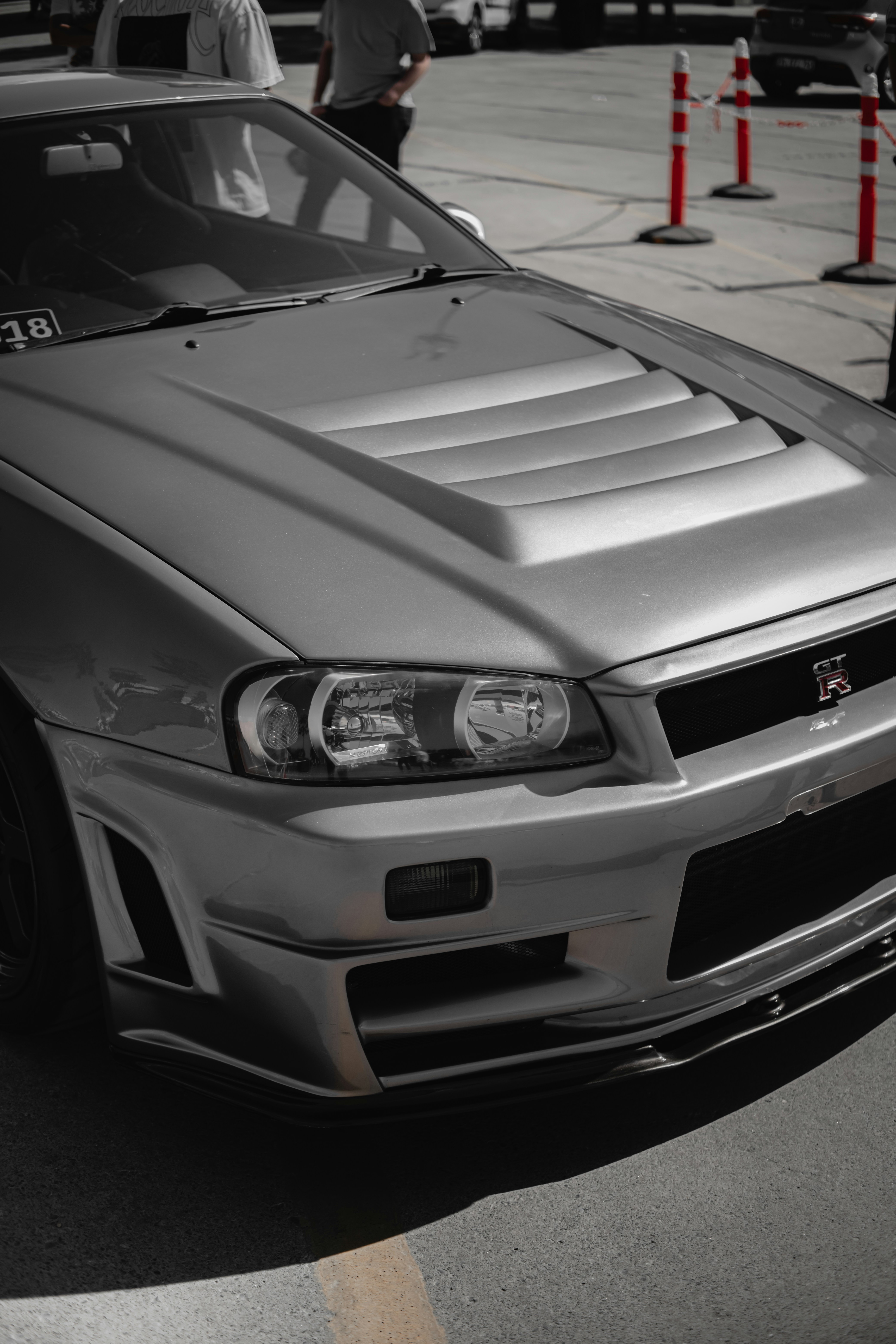 A silver car parked on the side of the road