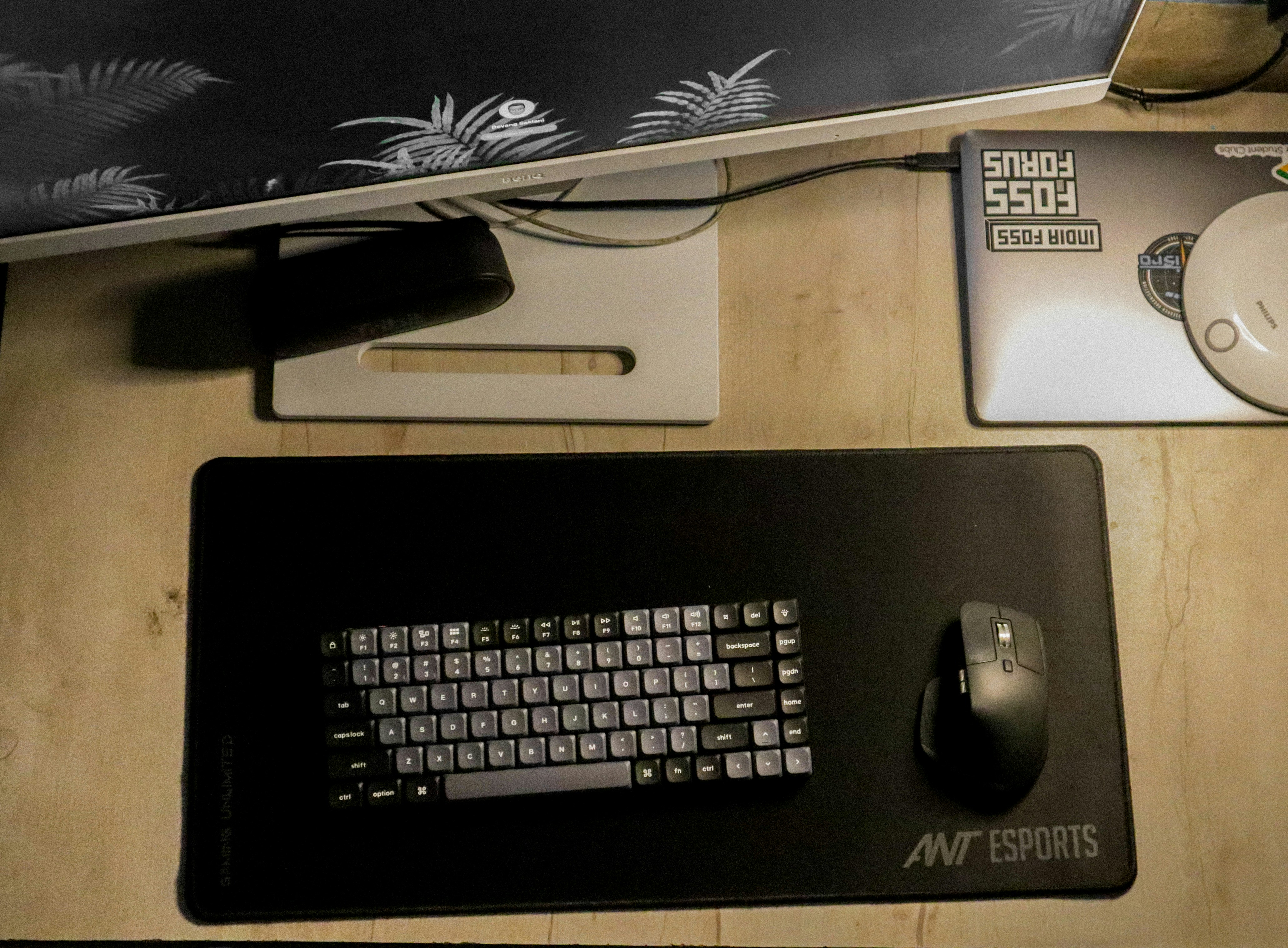 A computer keyboard and mouse on a desk