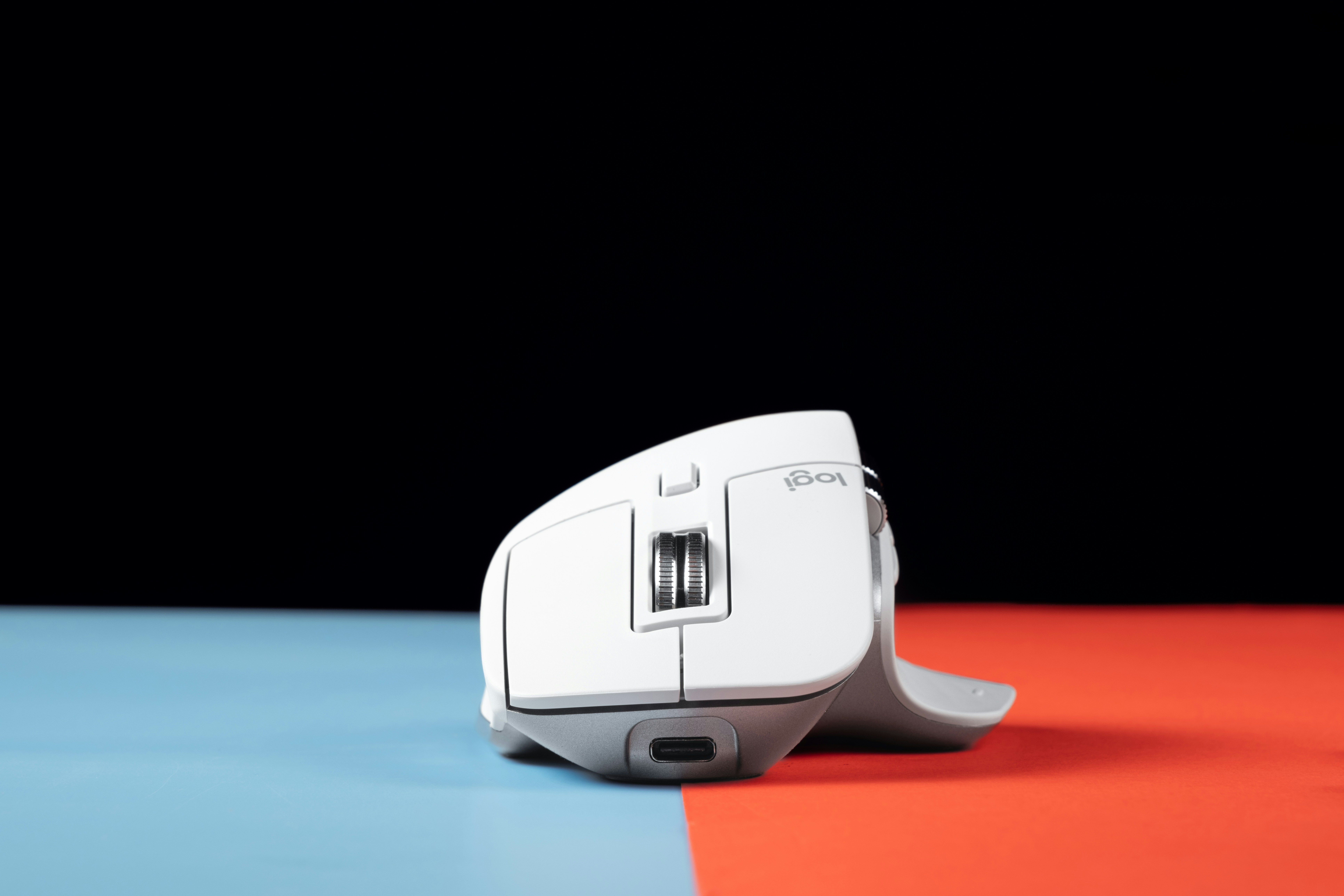 A computer mouse sitting on top of a table
