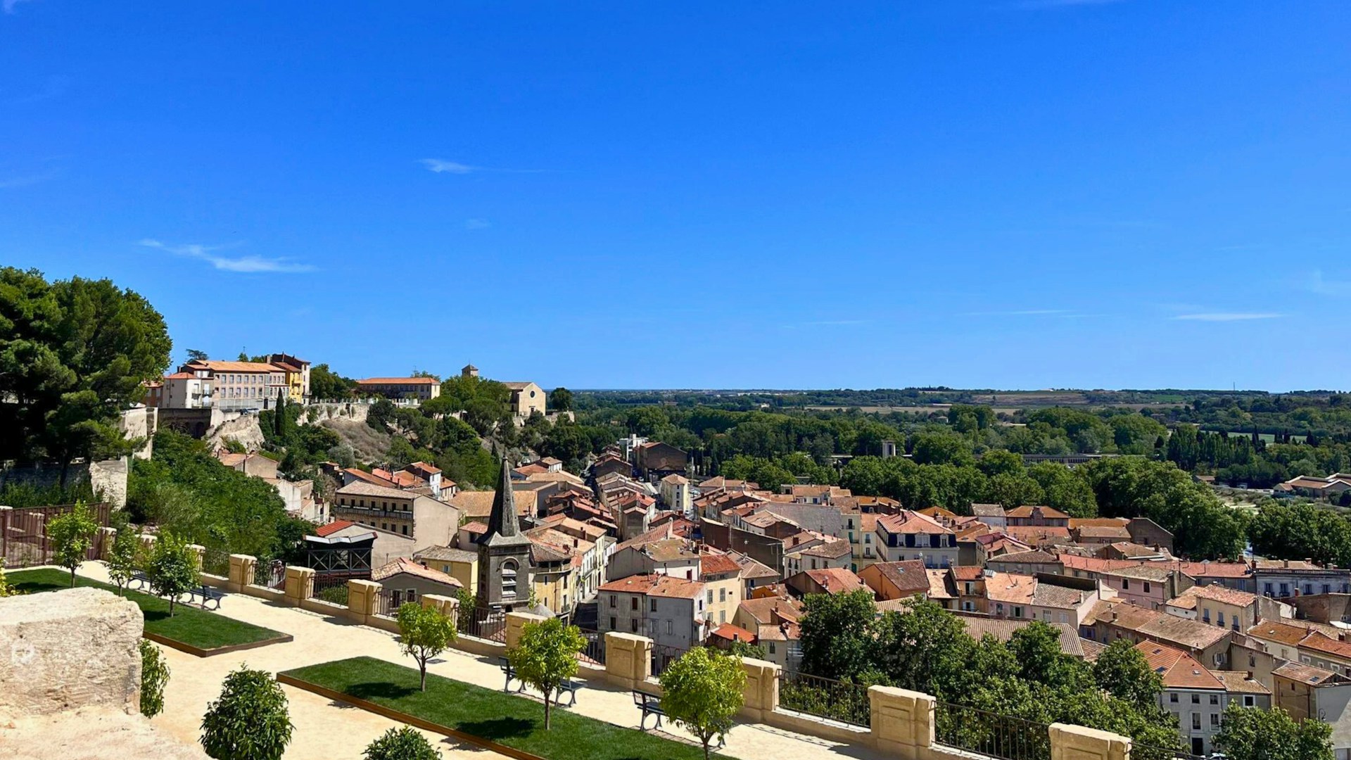 An aerial view of a small town with a lot of trees