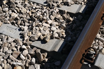 A close up of a train track with rocks