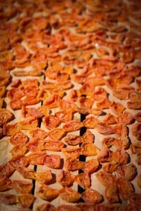 A close up of a pizza with tomatoes on it