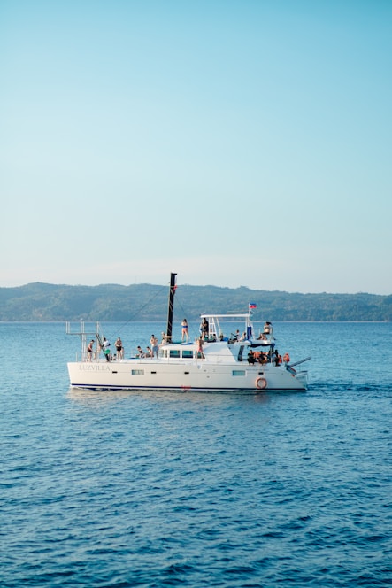 A boat with a lot of people on it in the water