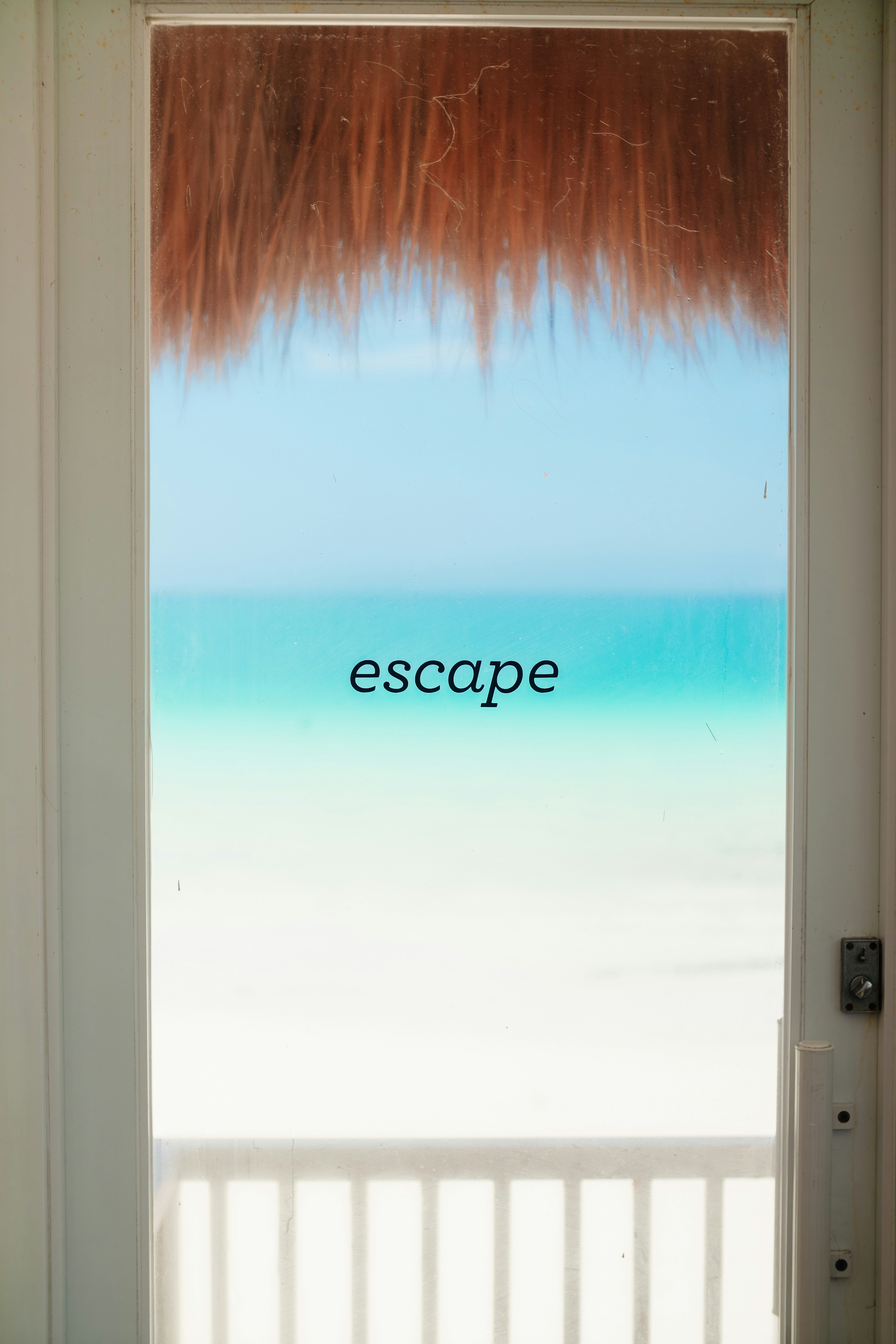 An open door with the words escape painted on it