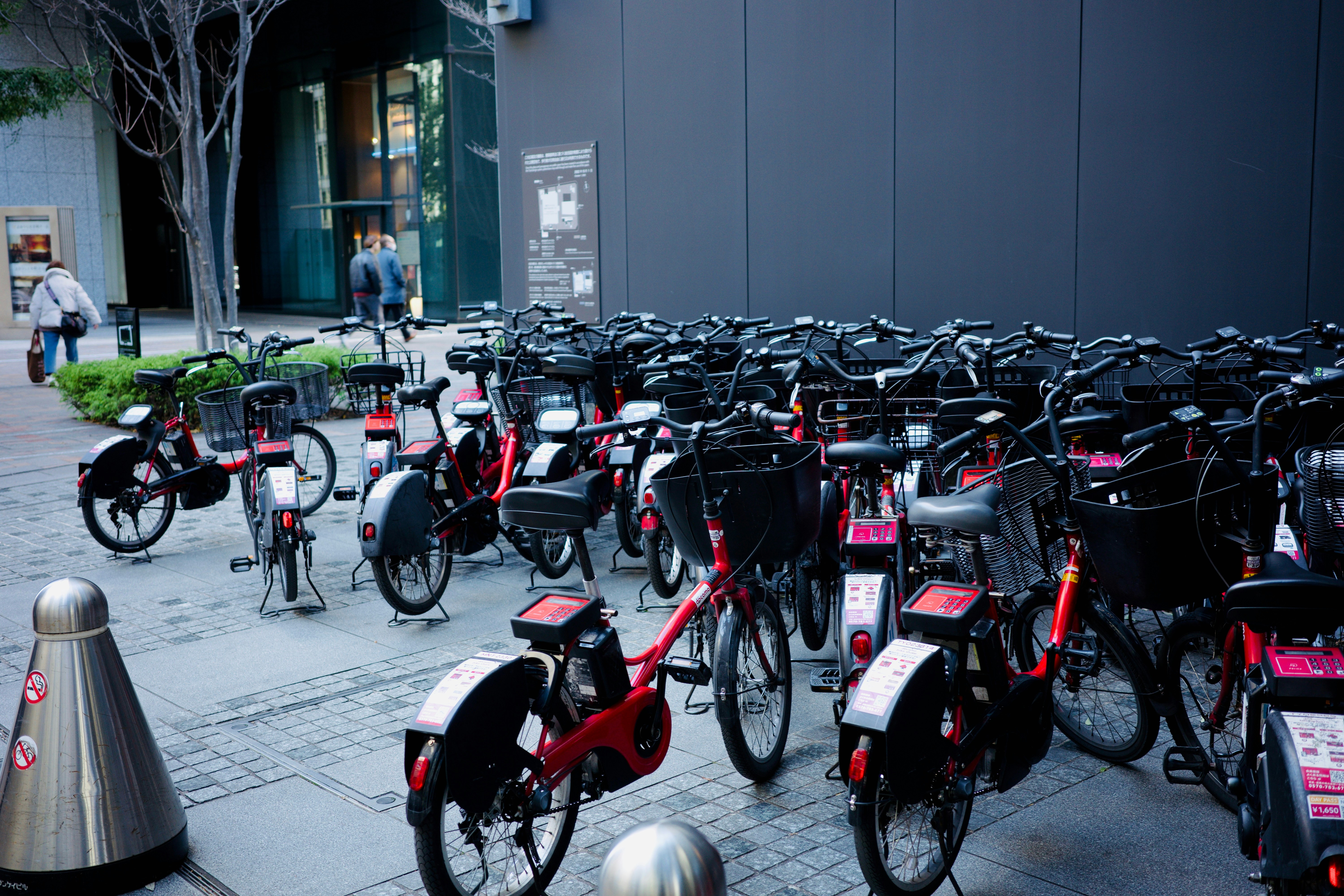 A large group of bikes parked next to each other