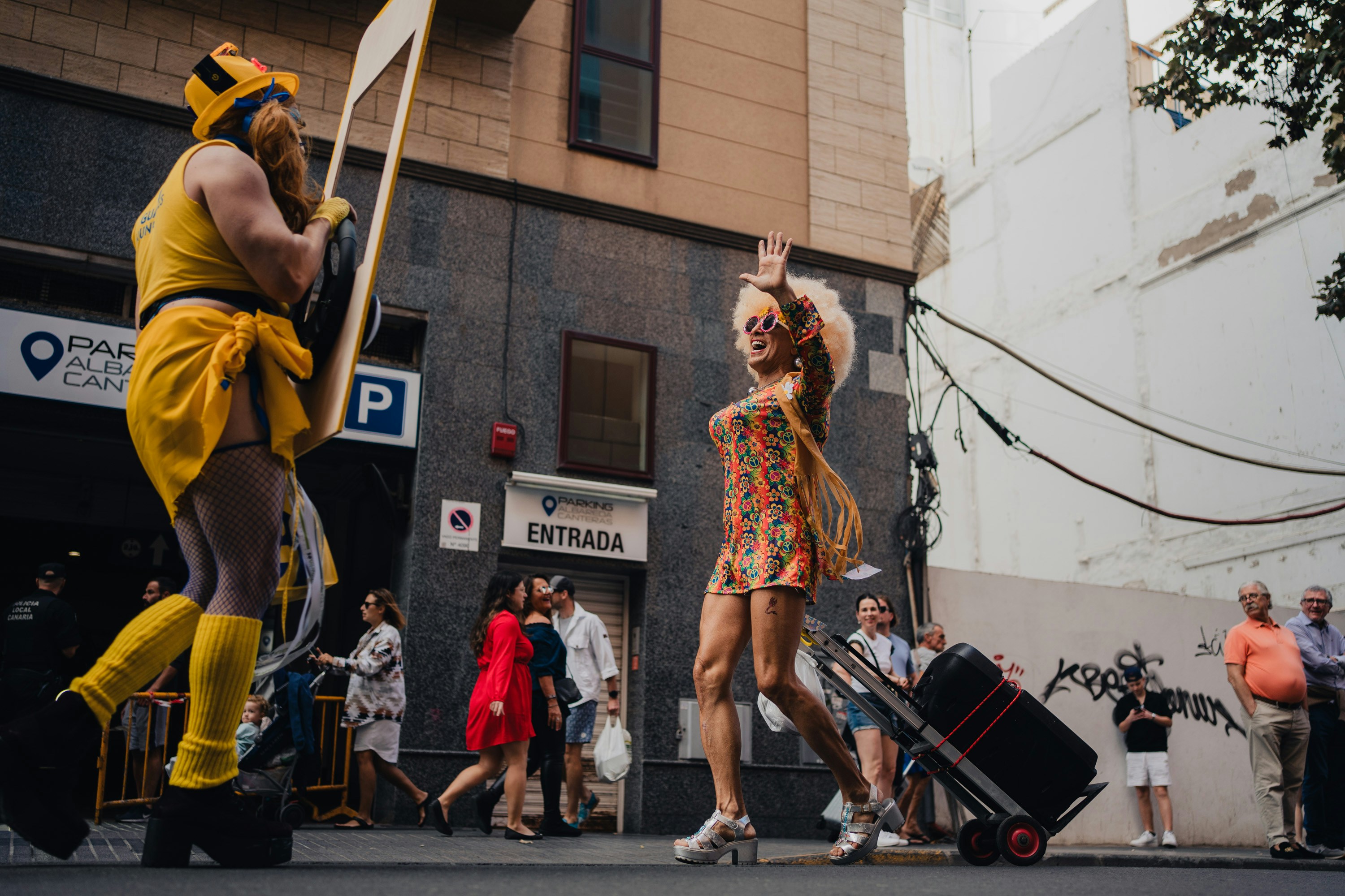 A couple of people that are standing in the street