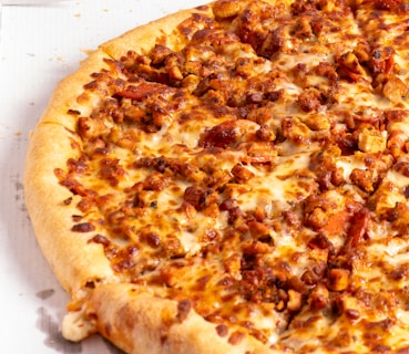 A large pizza sitting on top of a table