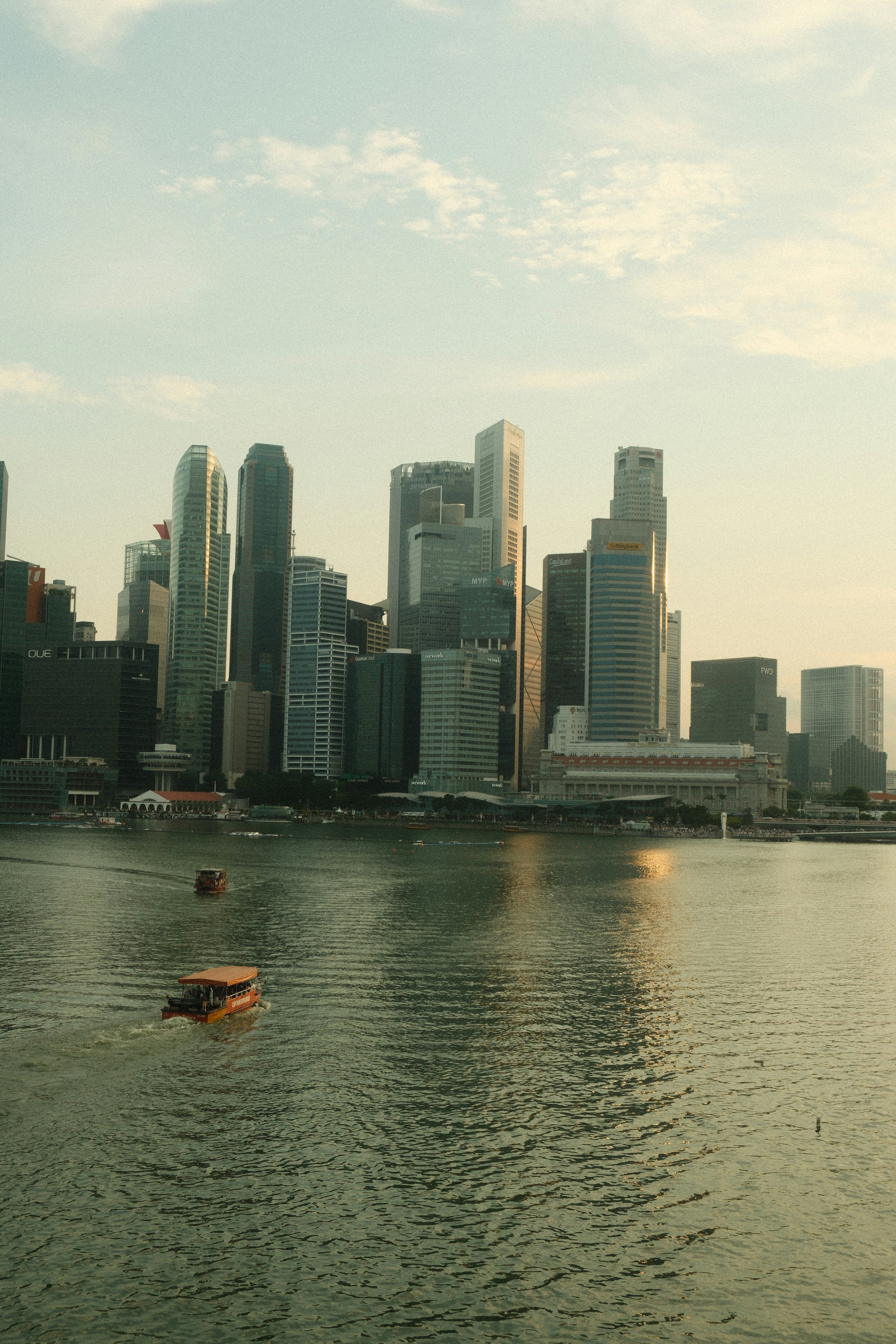 A large body of water with a city in the background