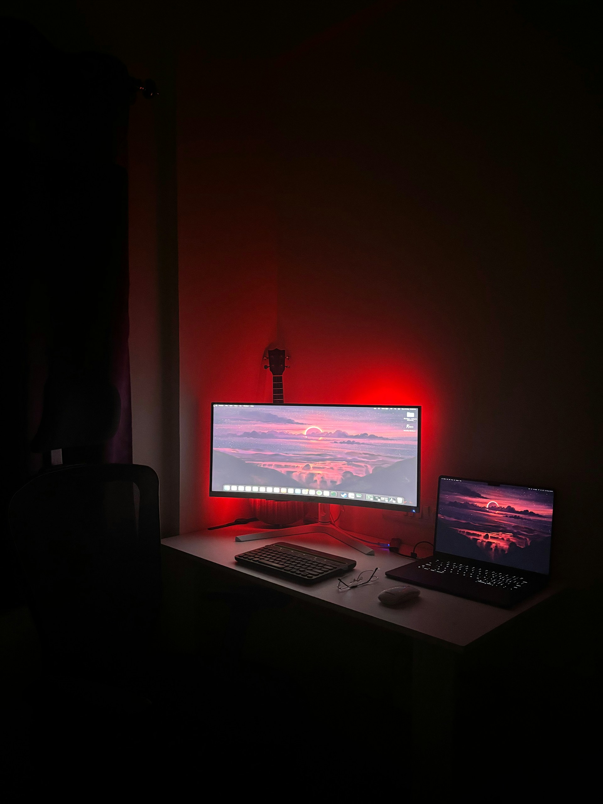 A desk with a computer and a laptop on it