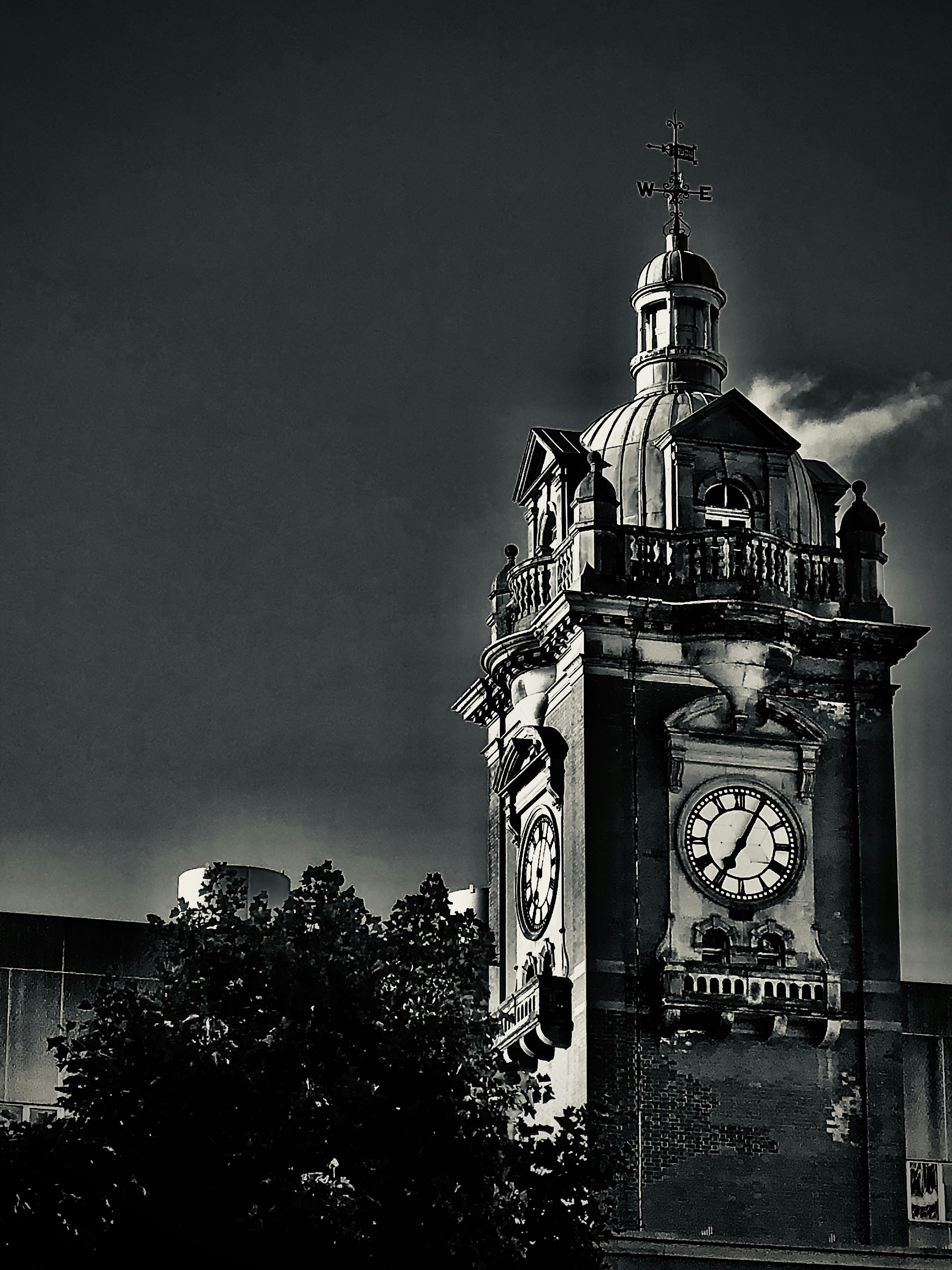 A black and white photo of a clock tower