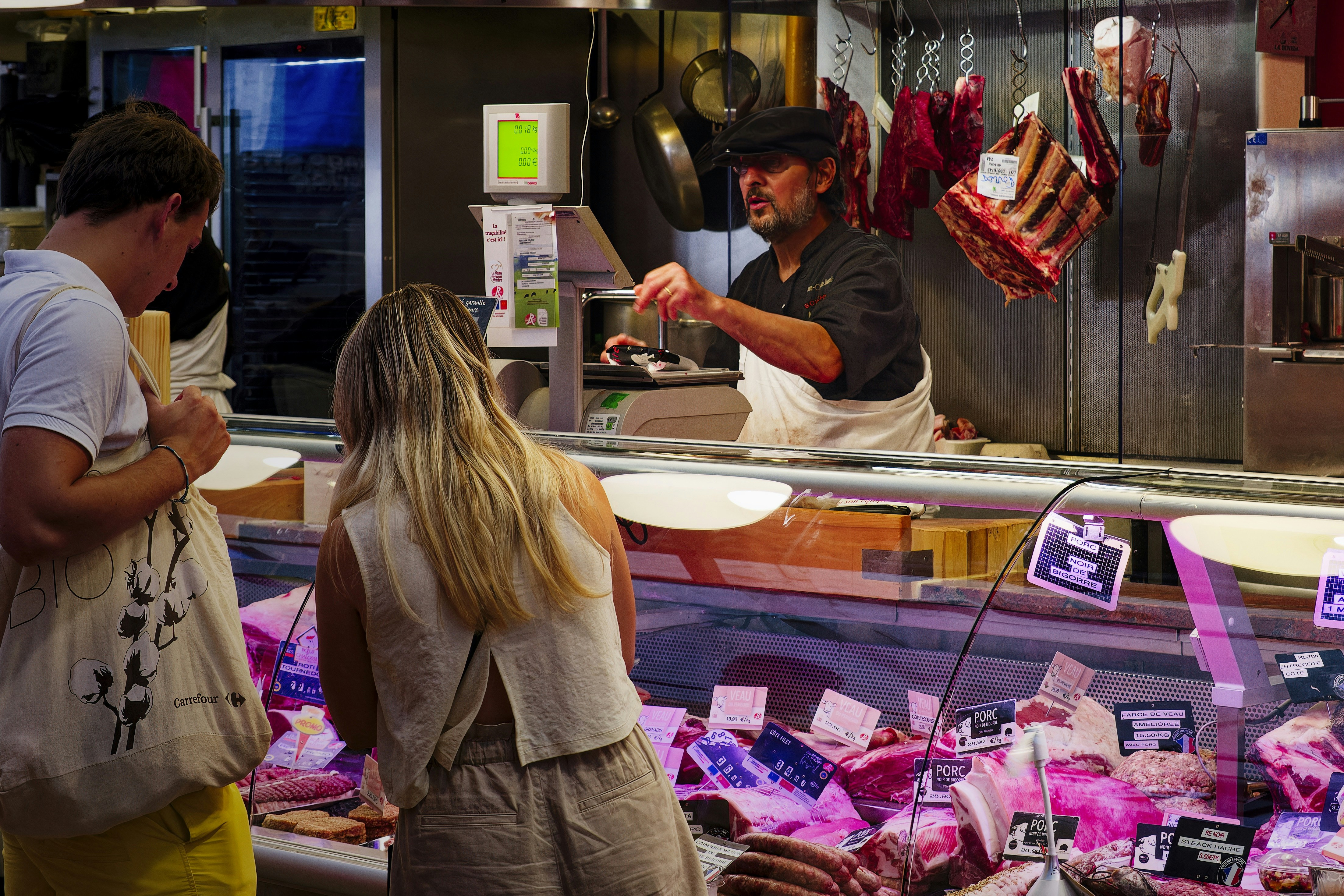 A group of people standing in front of a counter