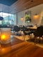 A restaurant with tables and chairs and a large window