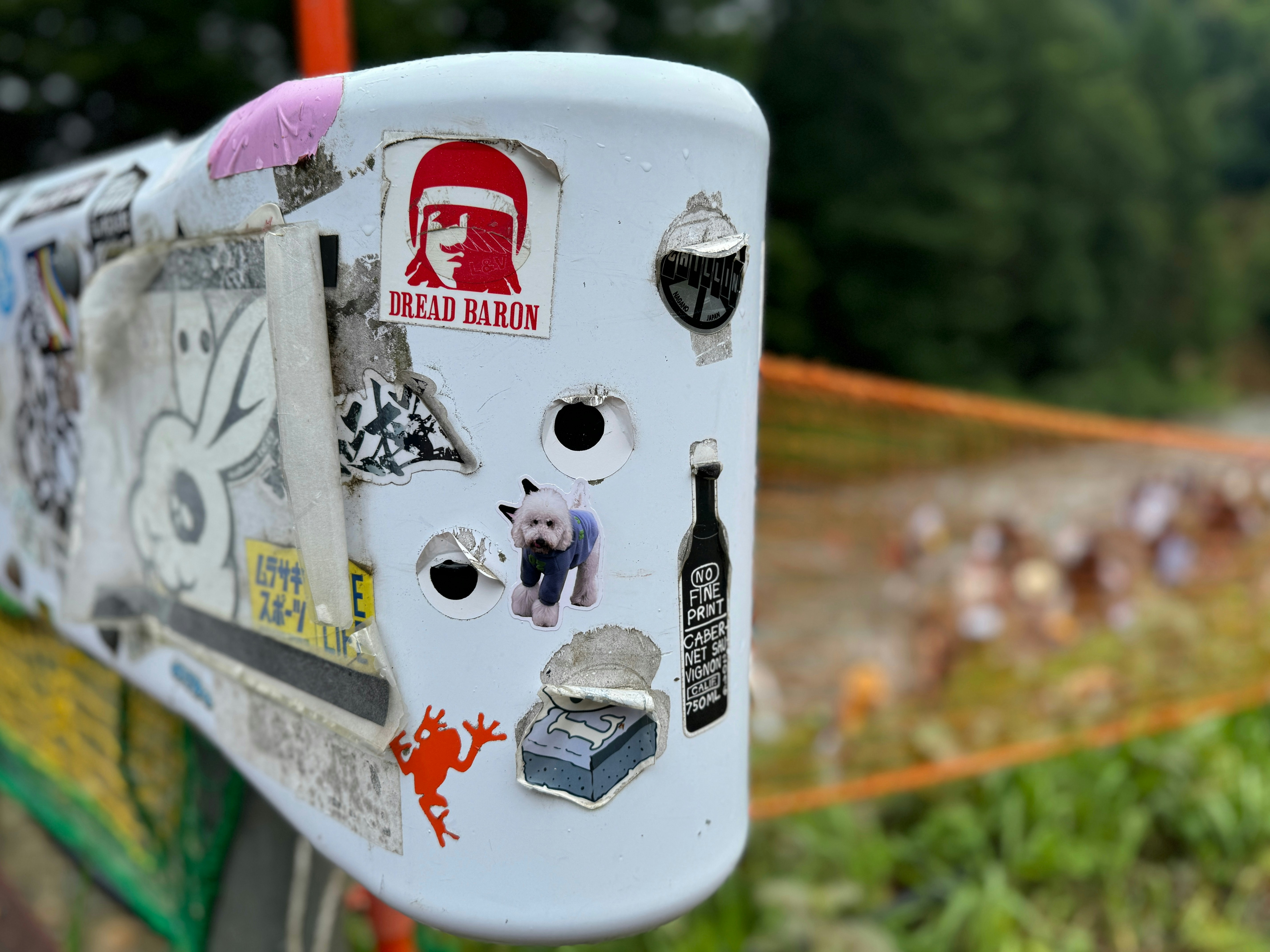 A close up of a mailbox with stickers on it