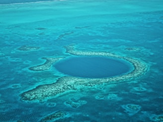 A large blue hole in the middle of the ocean