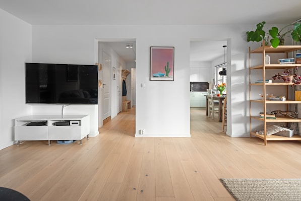A living room filled with furniture and a flat screen TV