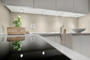 A kitchen with a sink and a counter top