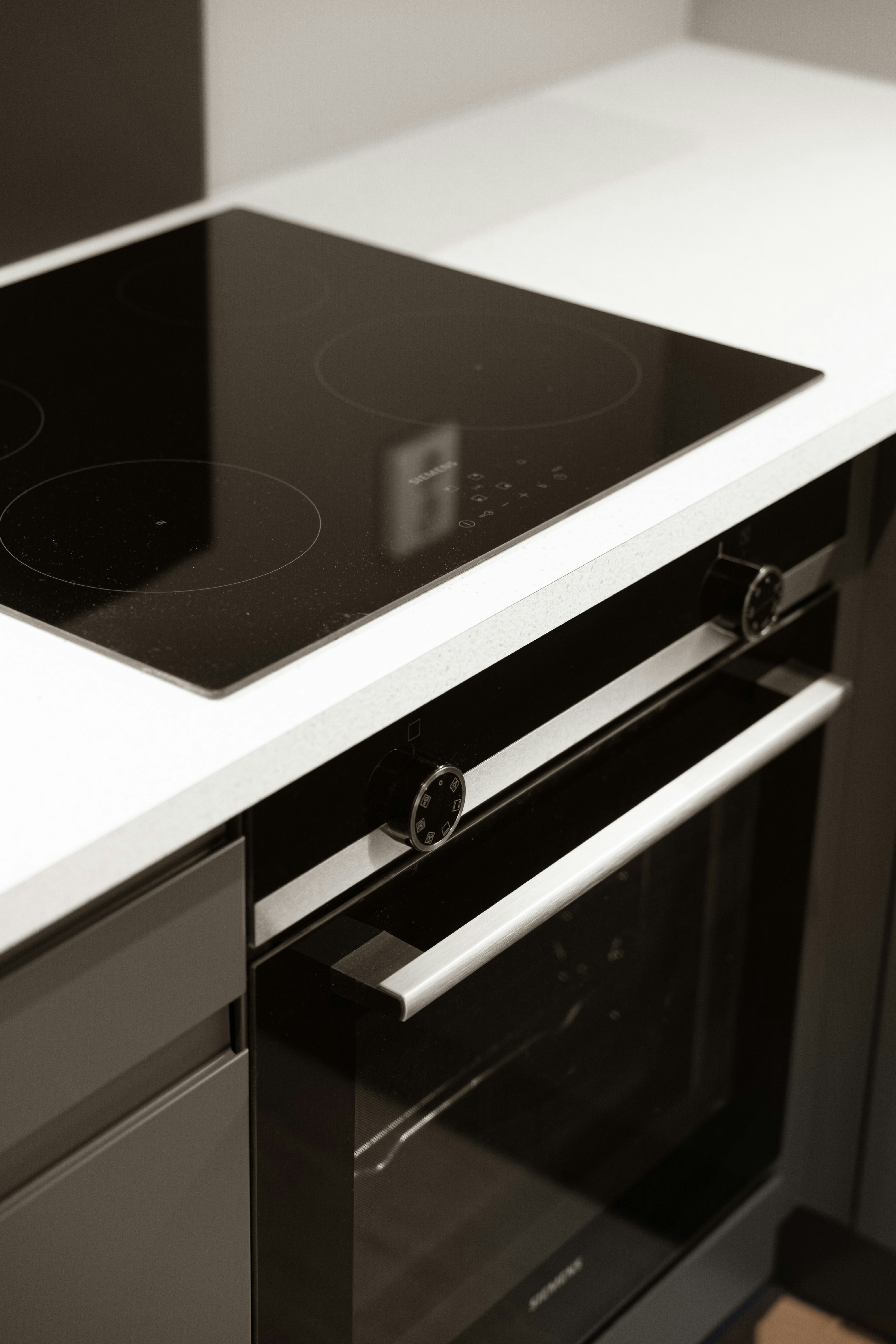 A black and white photo of a stove top oven