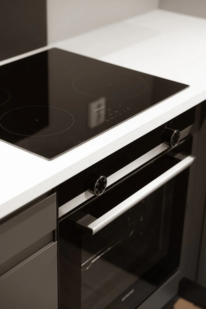 A black and white photo of a stovetop oven