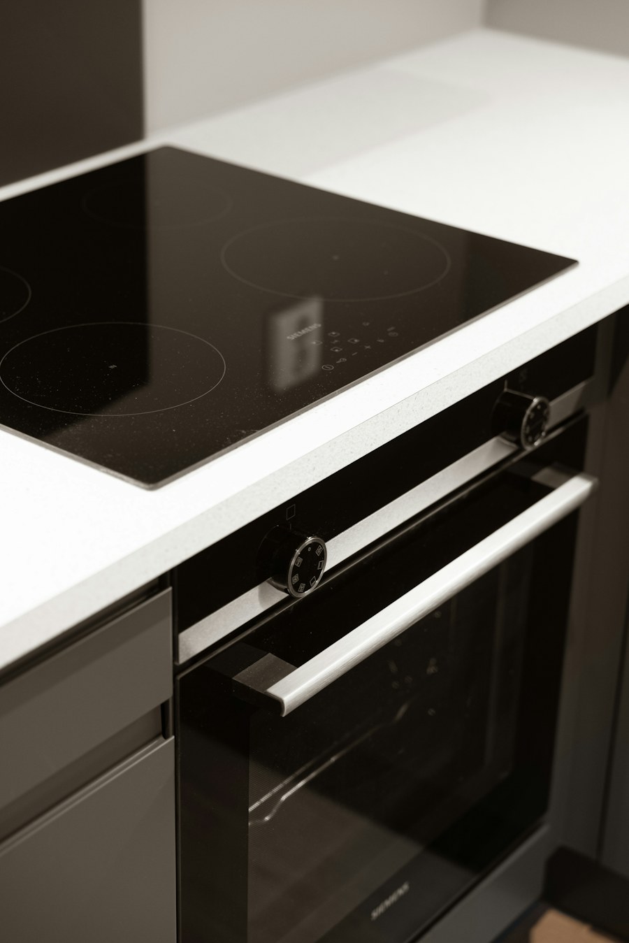 Glass cooktop installed above a built-in electric oven