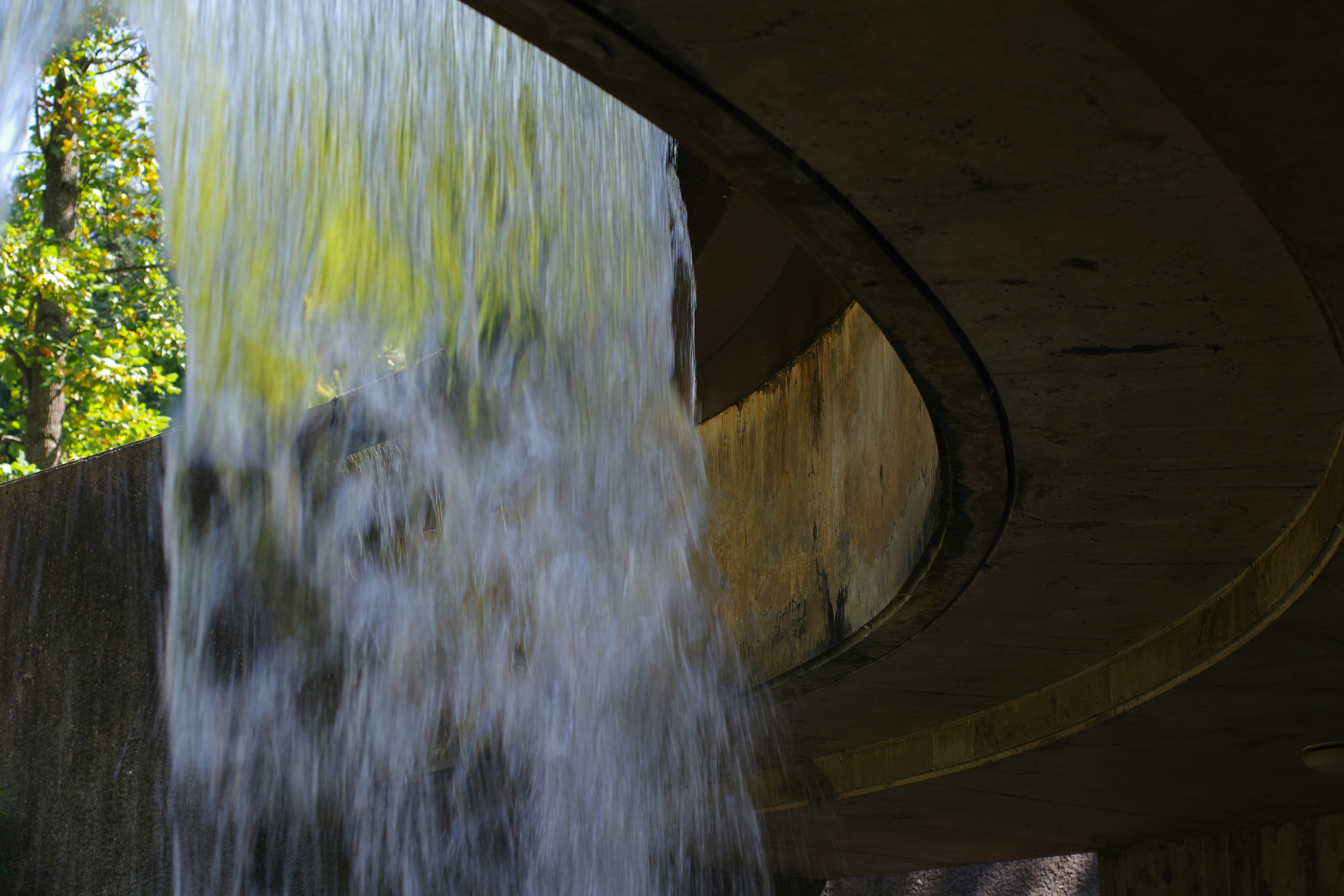 A water fall coming out of a pipe