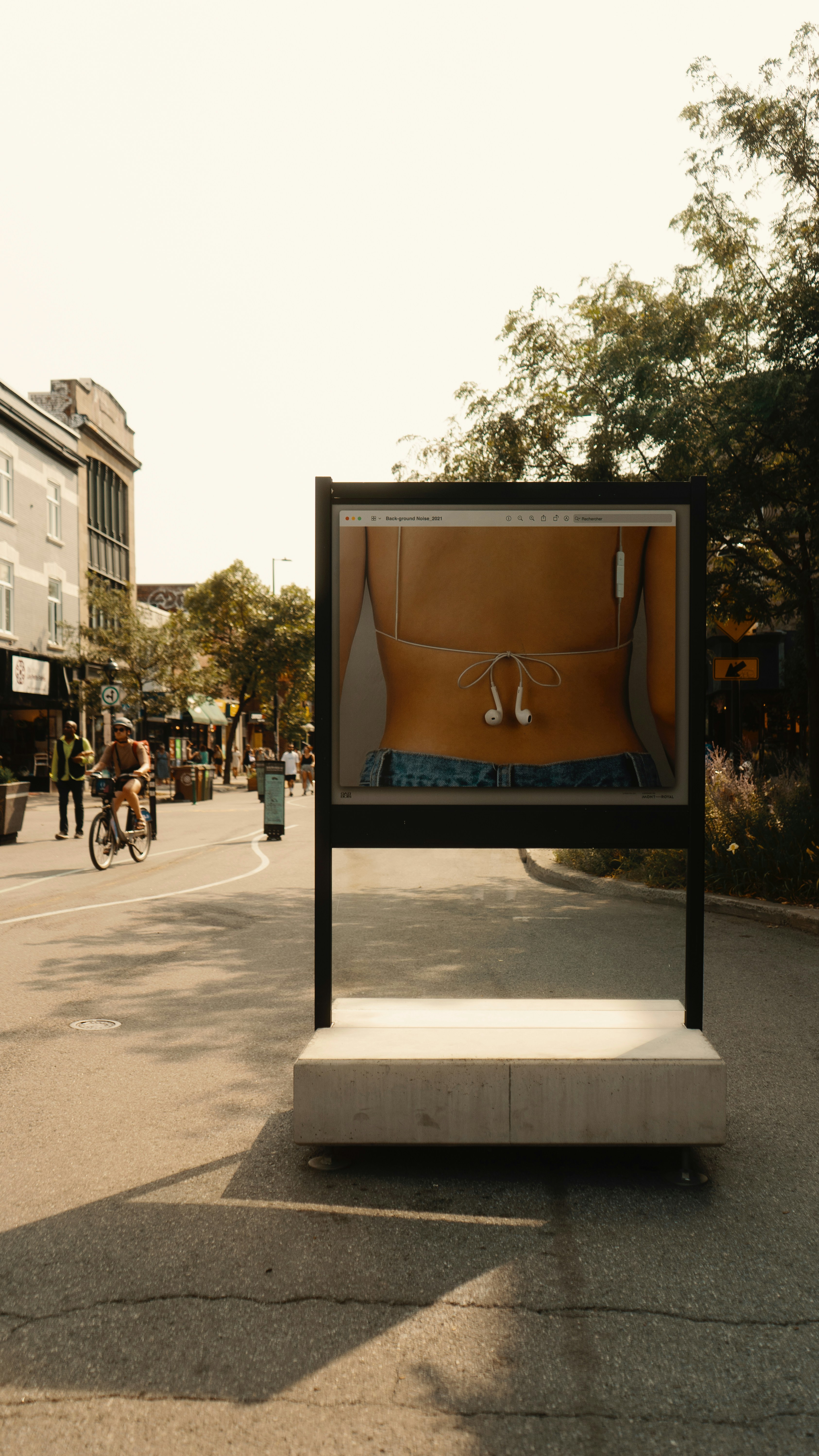 A picture of a woman's bra on display in the middle of the street