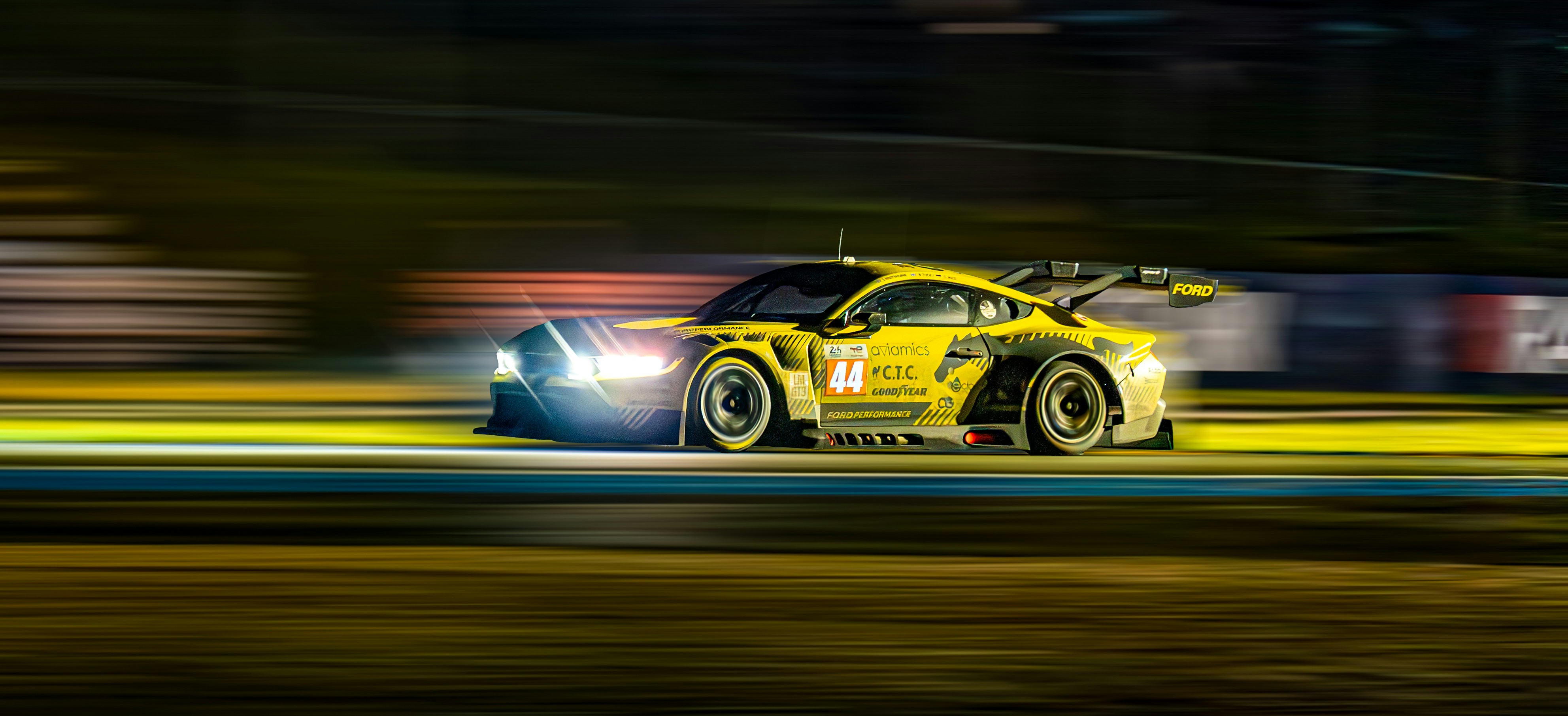 Race car on track, speed blur, dark moody atmosphere, motorsport photography Thailand