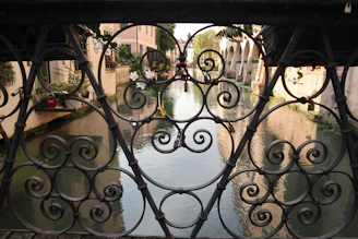 A view of a canal through a gate