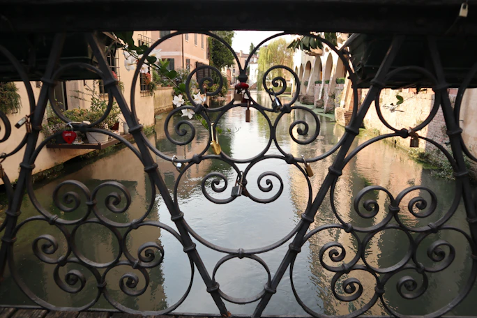 A view of a canal through a gate