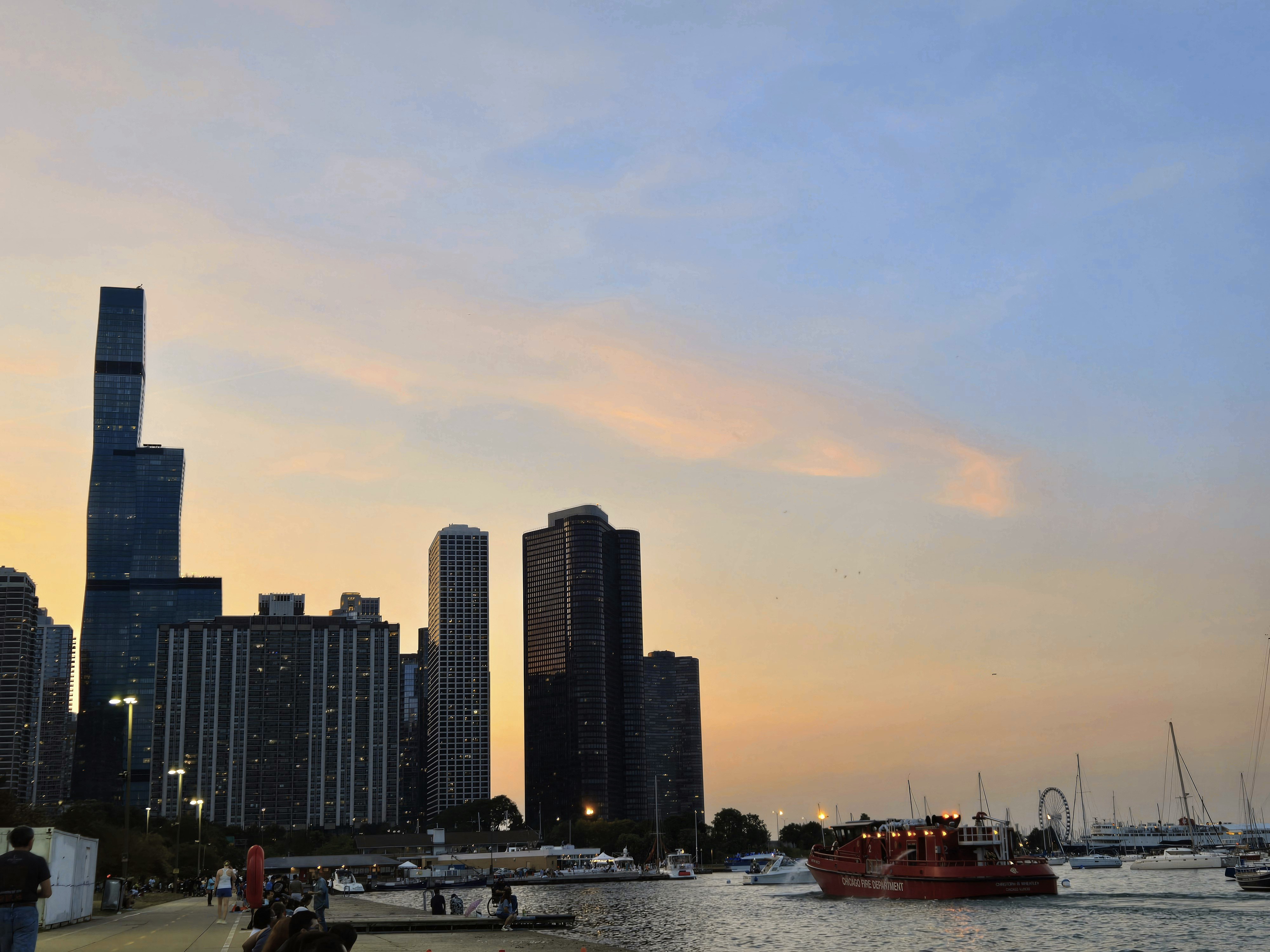 A group of boats floating on top of a body of water