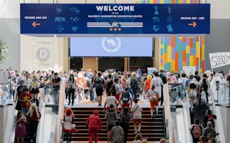A group of people walking up and down a flight of stairs