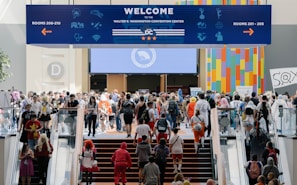 A group of people walking up and down a flight of stairs