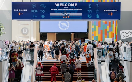 A group of people walking up and down a flight of stairs