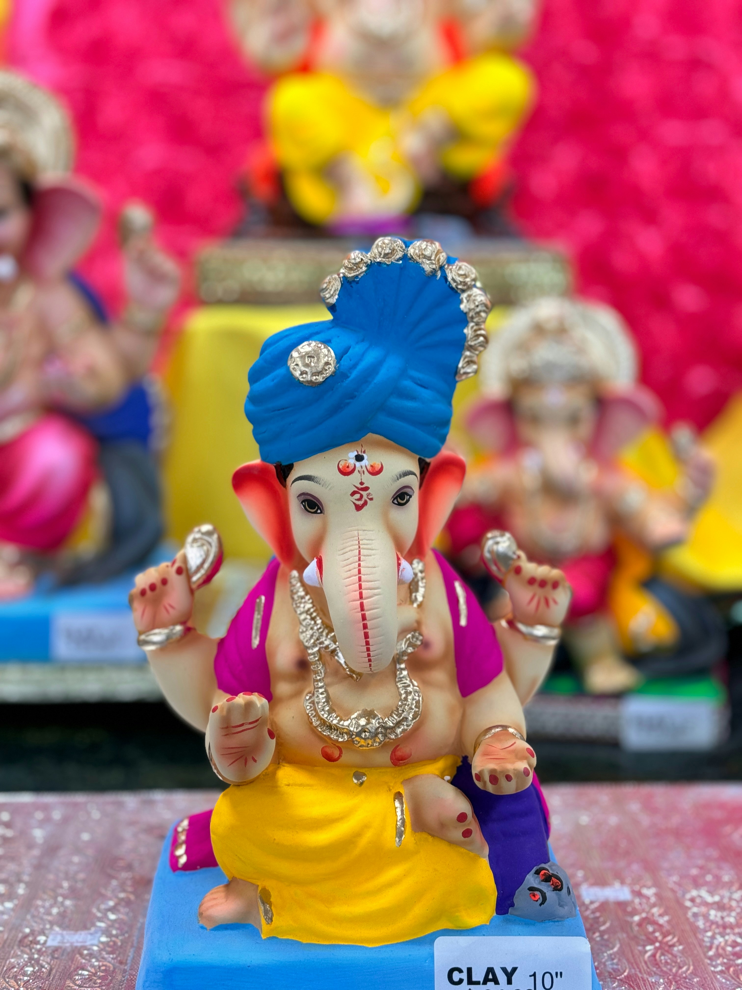 A small statue of an elephant sitting on a table