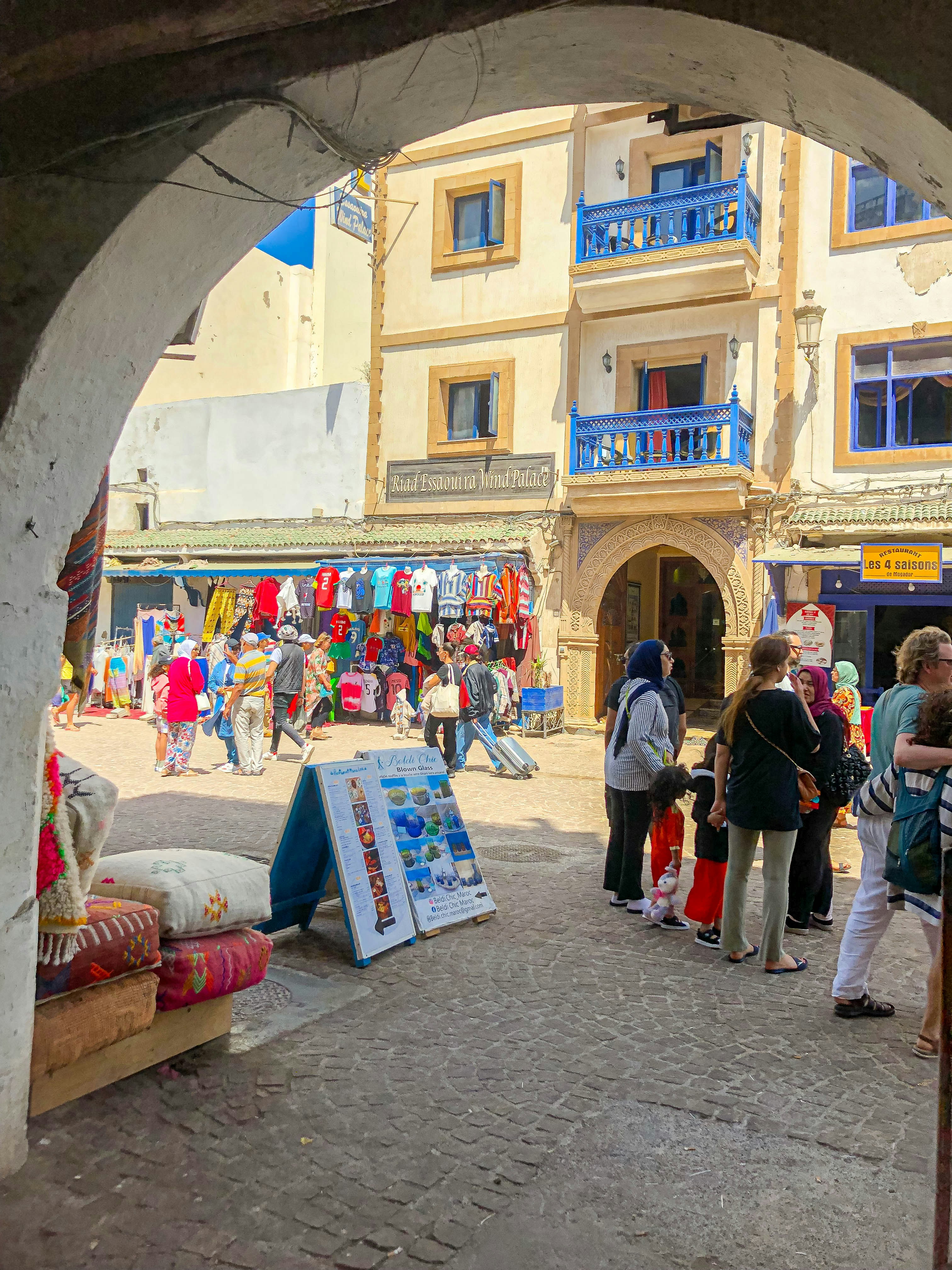 A group of people standing around a market
