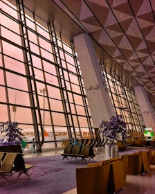 A large building with a lot of windows and chairs