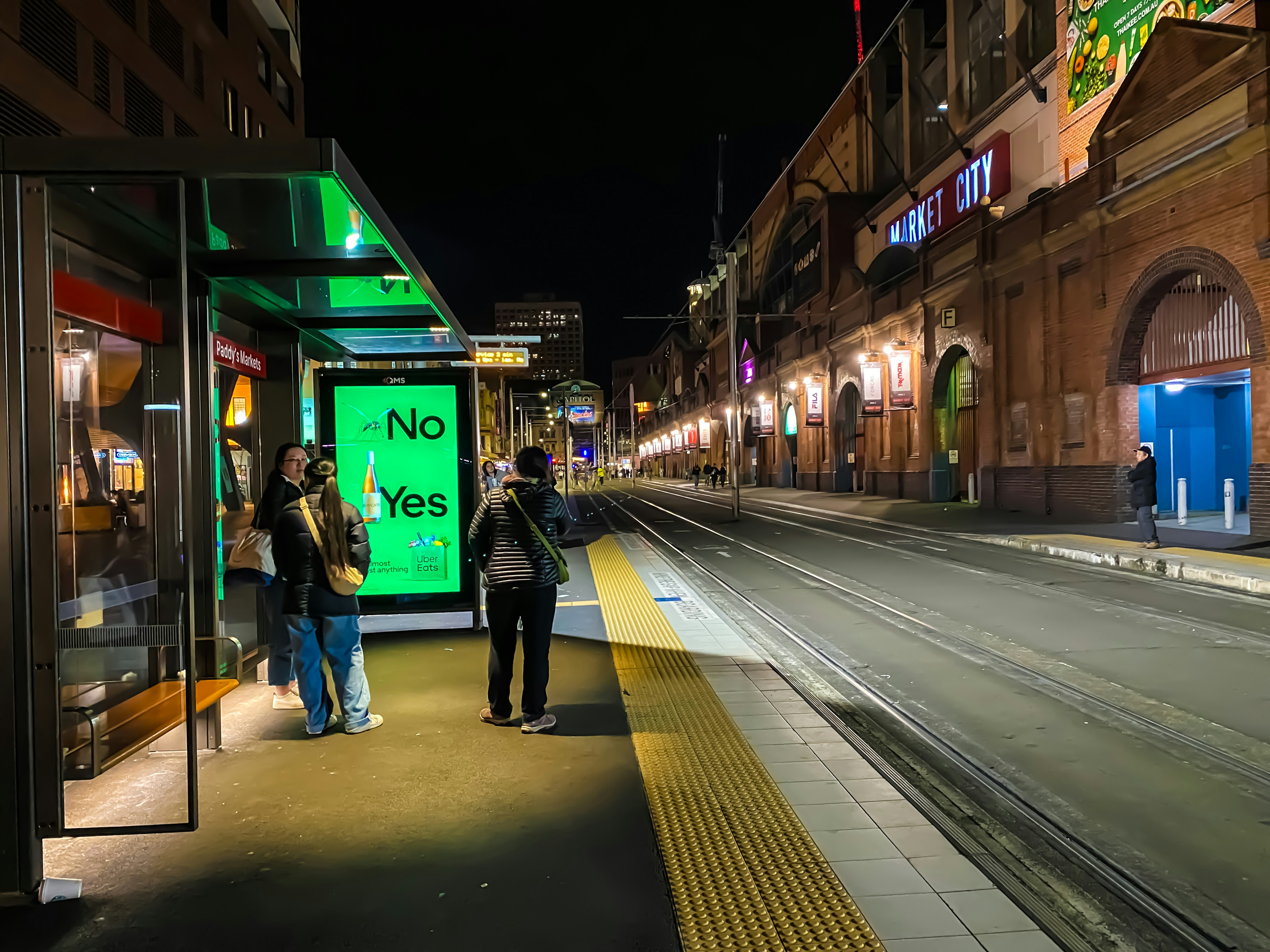 woman wearing yellow long-sleeved dress under white clouds and blue sky during daytime