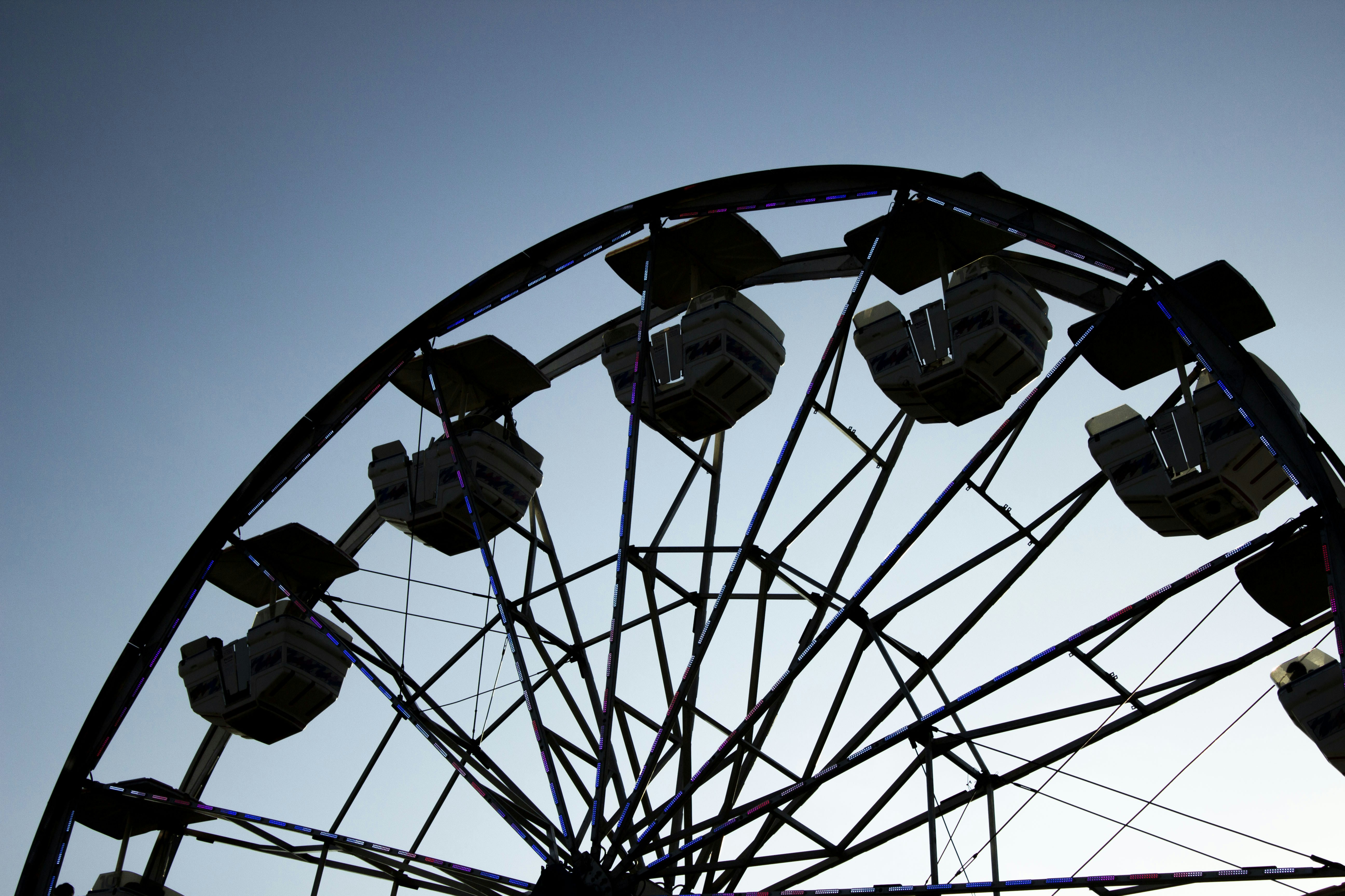 A ferris wheel with a blue sky in the background