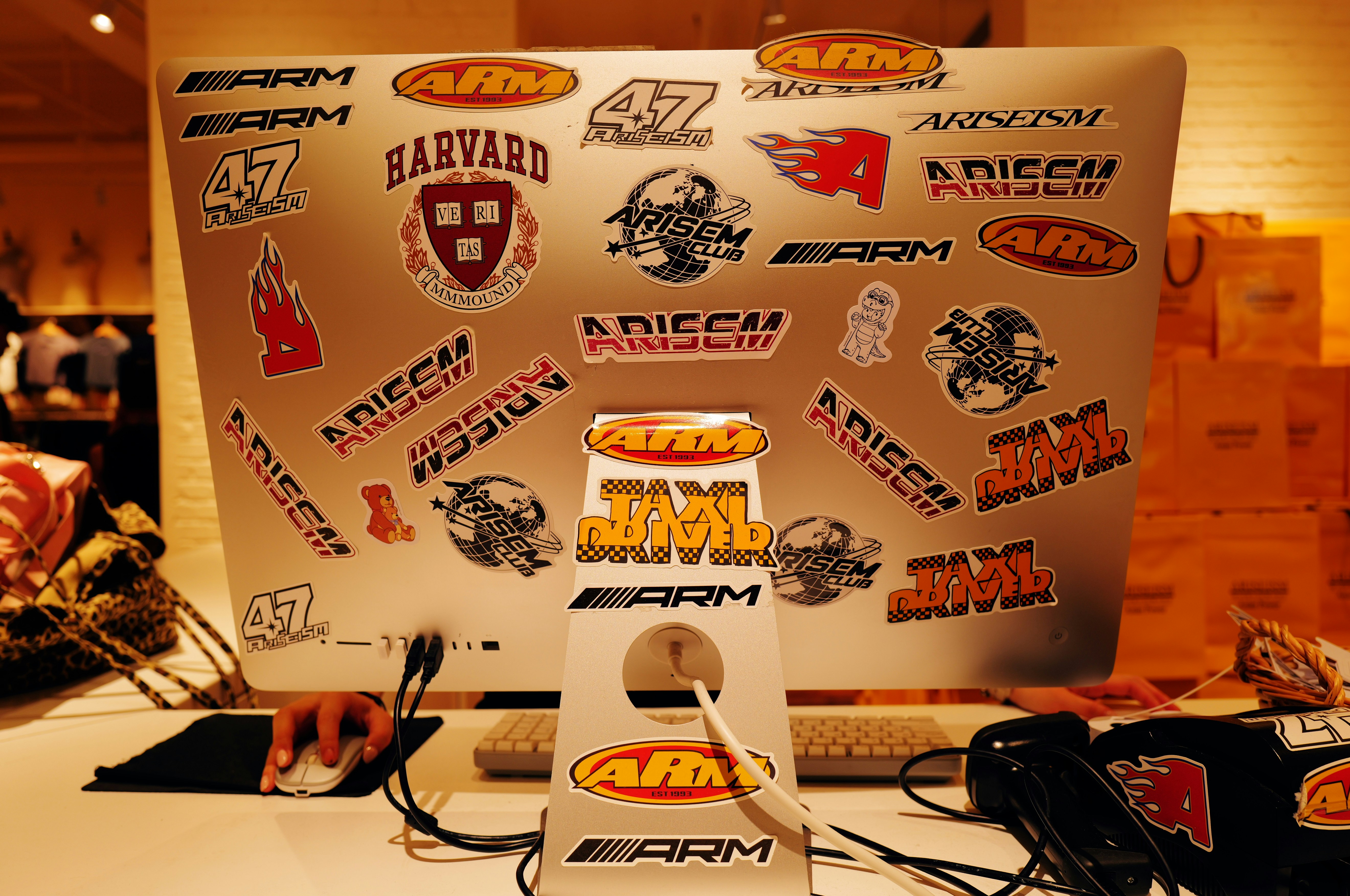 A computer with a lot of stickers on it