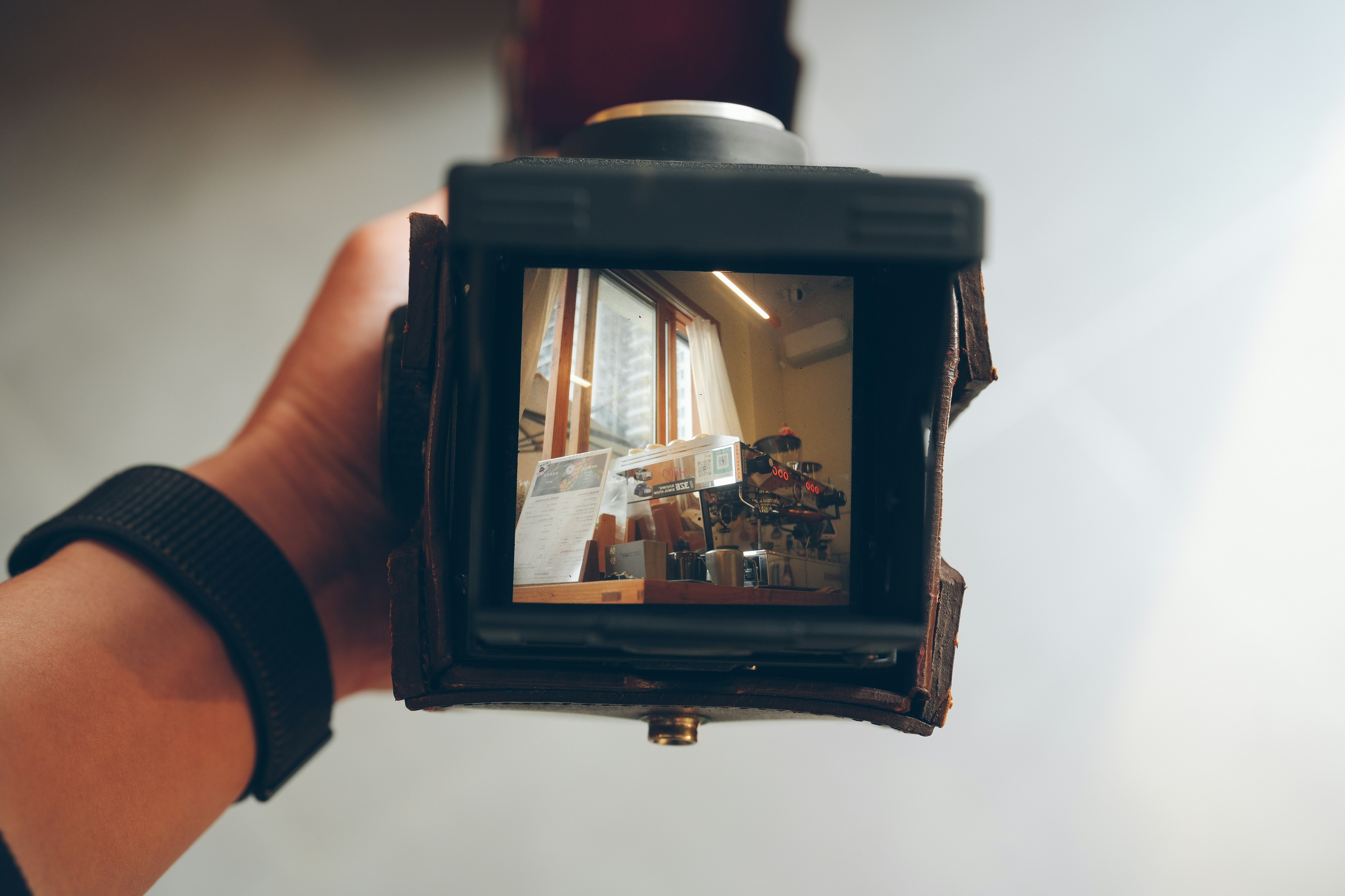 A person holding a camera up to take a picture