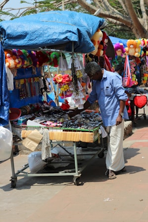 A man is standing in front of a vendor