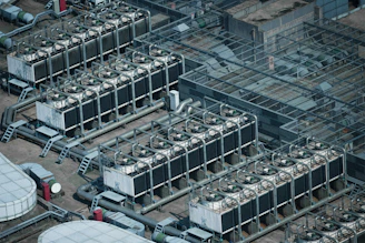 An aerial view of a factory with many tanks
