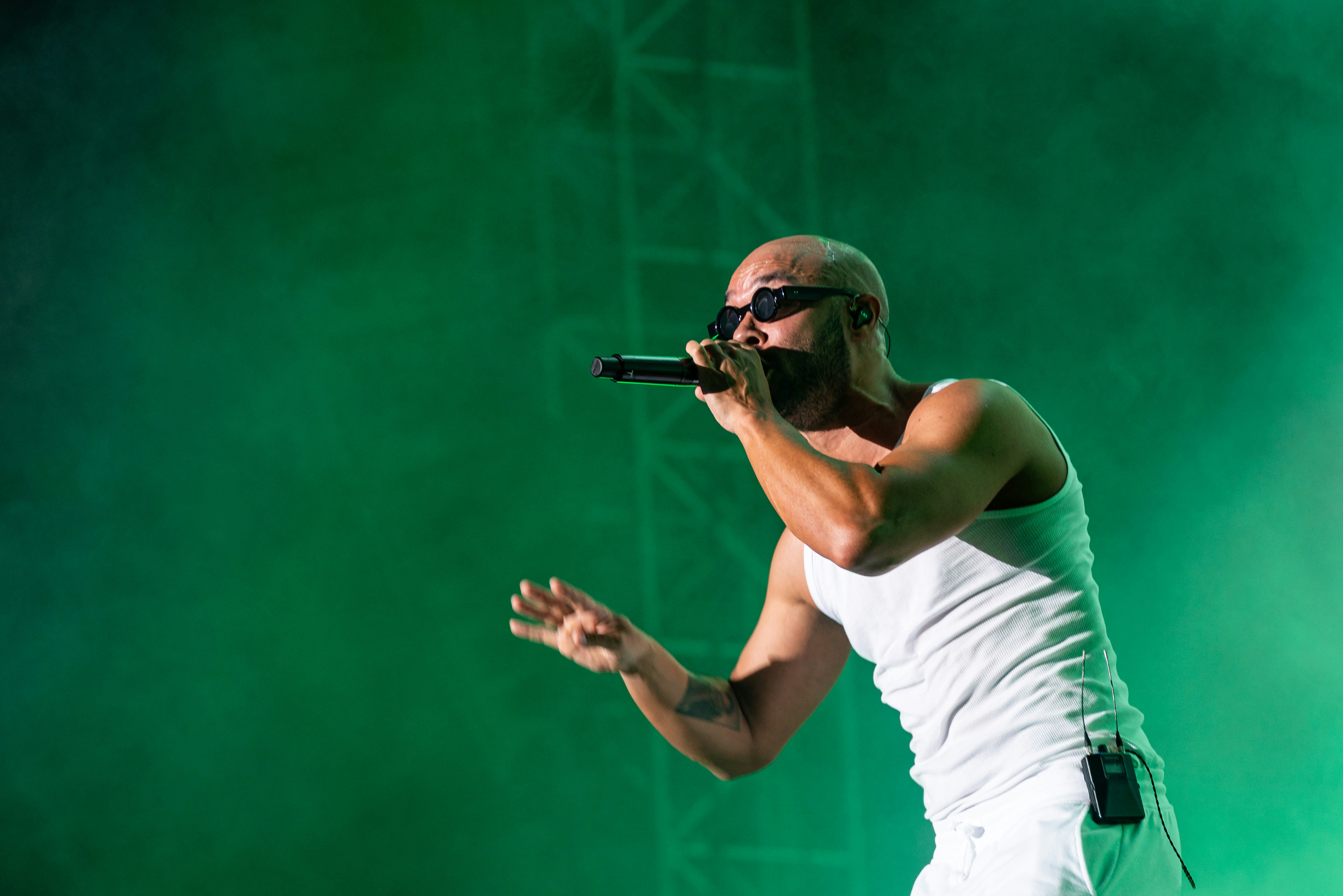 A man with a microphone on a stage