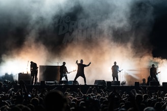 A group of people standing on top of a stage