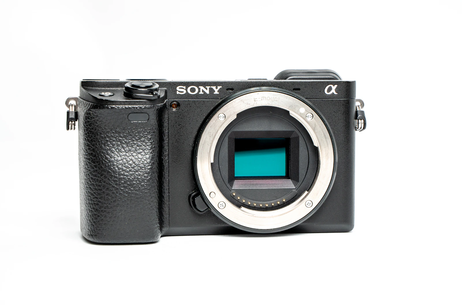 Black mirrorless camera on a clean white background