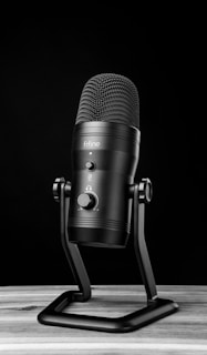 A microphone on a stand on a table