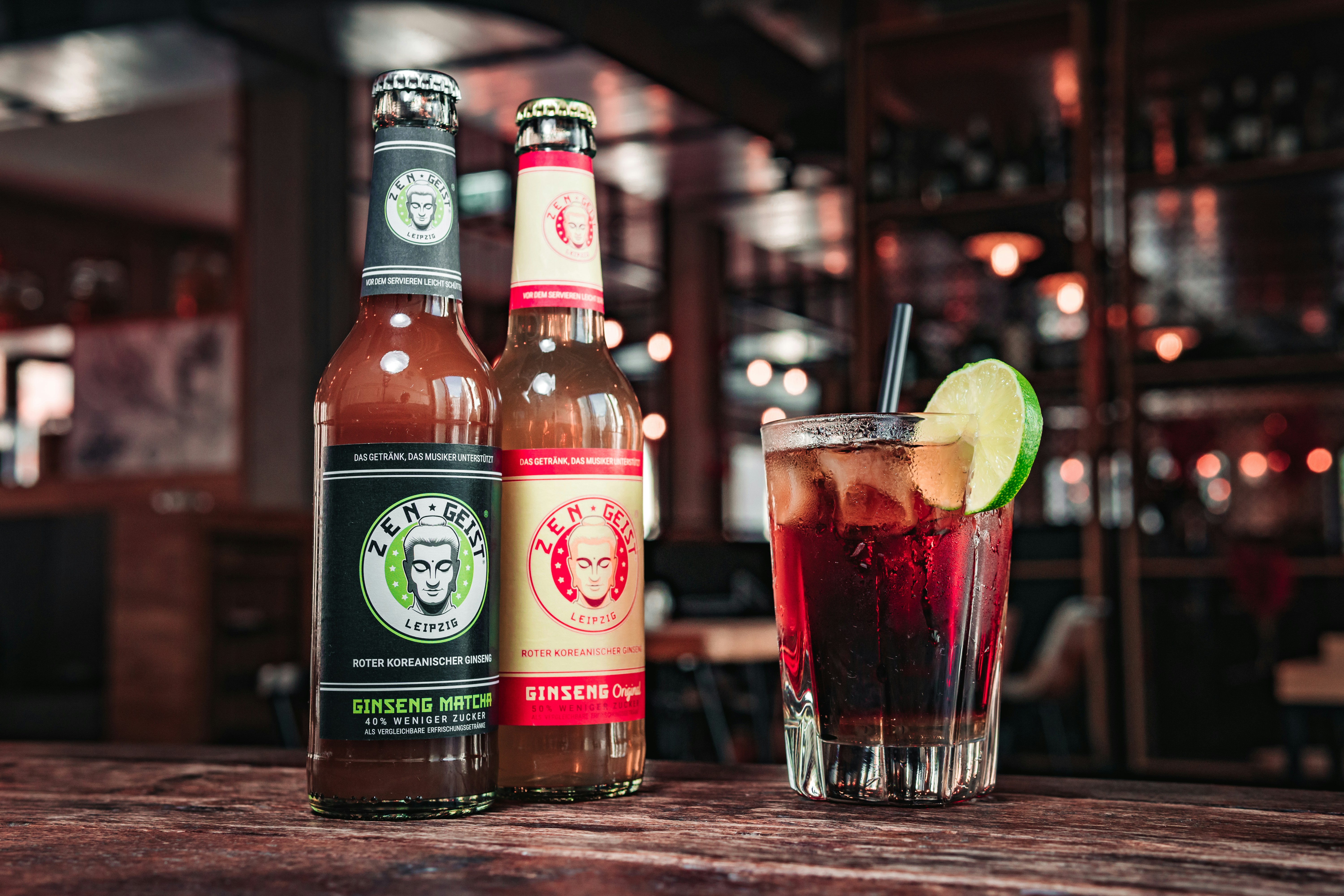 A couple of bottles of beer sitting on top of a table