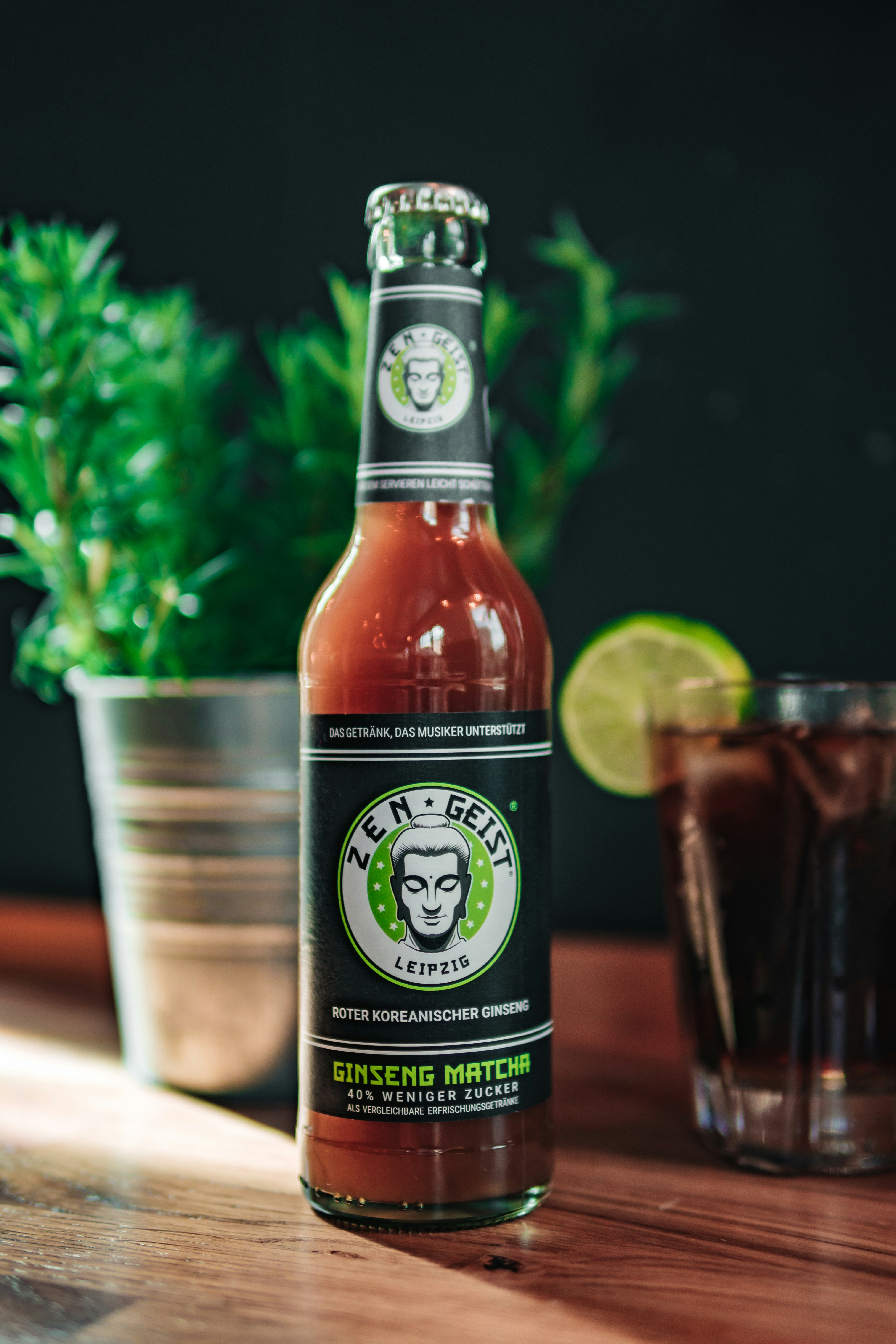 A bottle of beer sitting on top of a wooden table