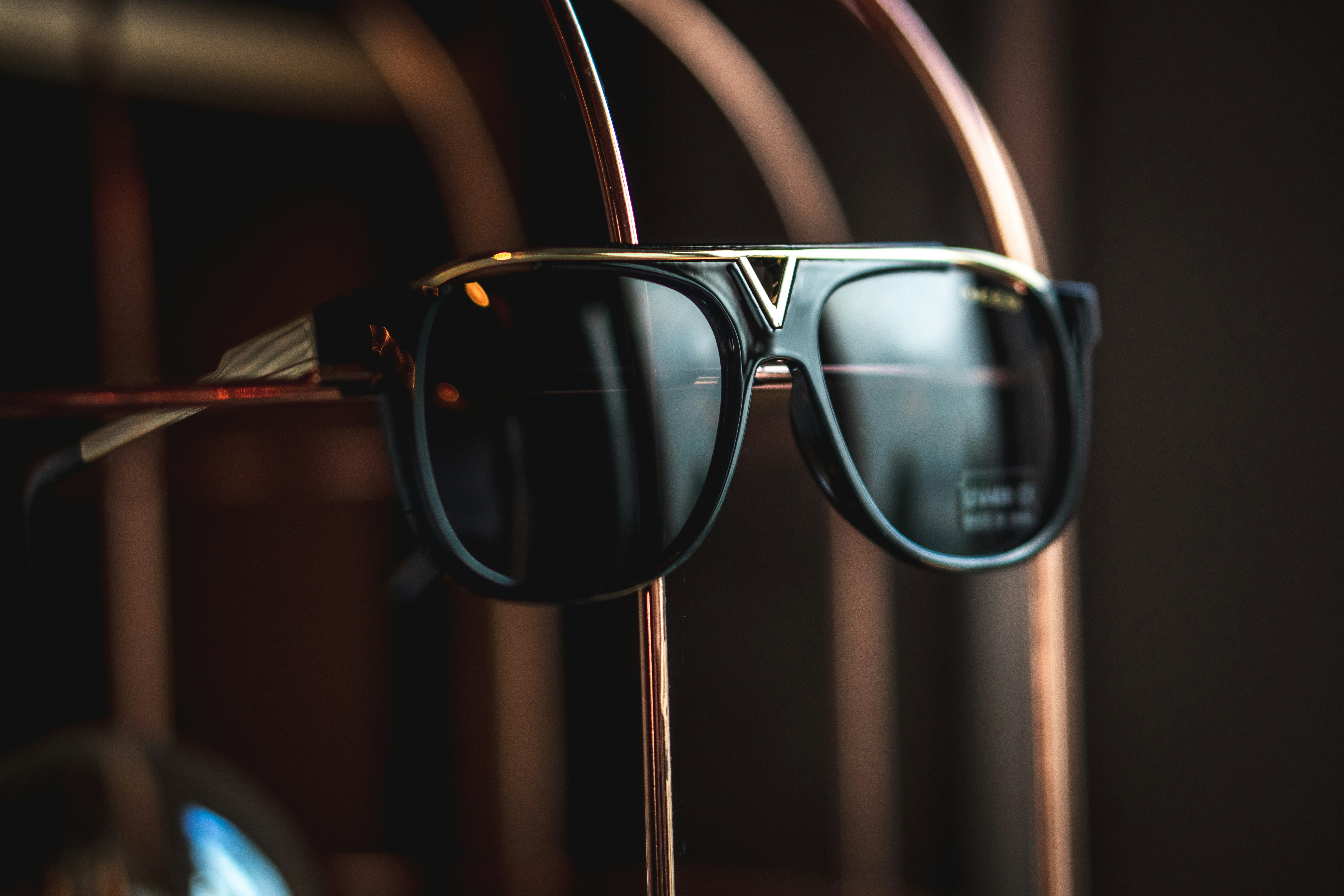 A pair of sunglasses sitting on top of a stand
