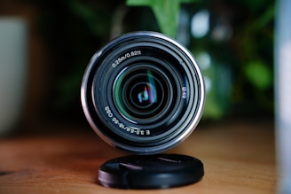 A camera lens sitting on top of a wooden table