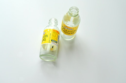 A bottle of mouthwash sitting next to a bottle of mouthwash